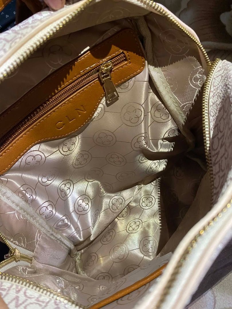 CLN Monogram Backpack (Category: Backpacks) located in Caloocan City. Submitted by vantagetrade (Listing ID 1461932700, Image 2). Description: - Once used - Chic cream and brown monogram design - Spacious main zippered compartment - Convenient front pocket - Adjustable shoulder straps for comfort - Elegant gold-tone hardware - Includes a protective dust bag May bawas sa sure buyer.