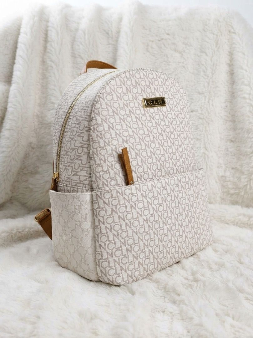 CLN Monogram Backpack (Category: Backpacks) located in Caloocan City. Submitted by vantagetrade (Listing ID 1461932700, Image 1). Description: - Once used - Chic cream and brown monogram design - Spacious main zippered compartment - Convenient front pocket - Adjustable shoulder straps for comfort - Elegant gold-tone hardware - Includes a protective dust bag May bawas sa sure buyer.