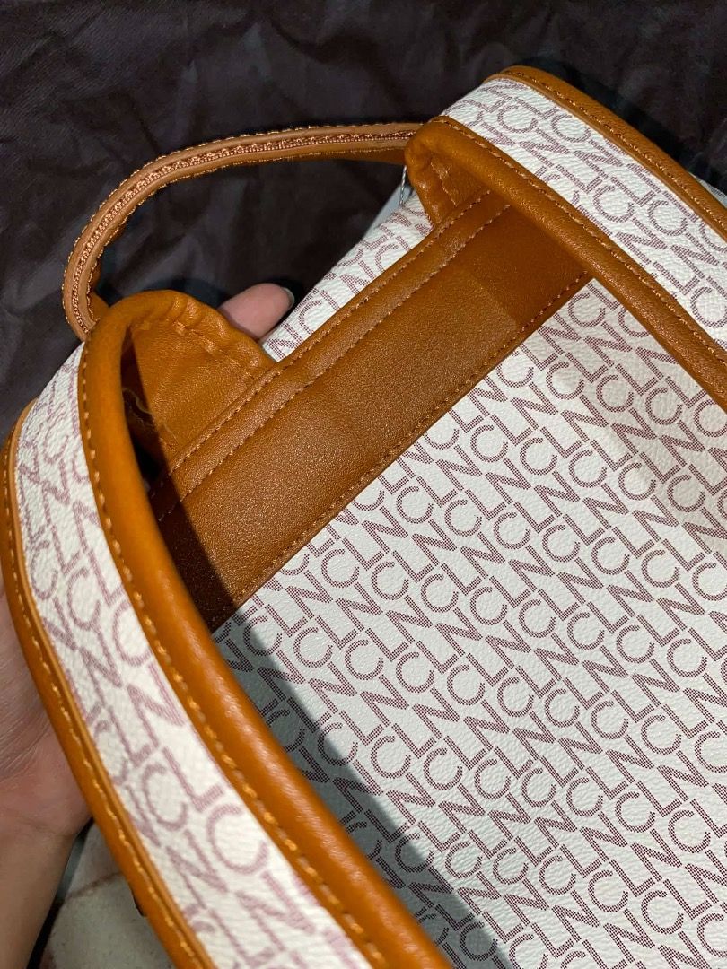 CLN Monogram Backpack (Category: Backpacks) located in Caloocan City. Submitted by vantagetrade (Listing ID 1461932700, Image 3). Description: - Once used - Chic cream and brown monogram design - Spacious main zippered compartment - Convenient front pocket - Adjustable shoulder straps for comfort - Elegant gold-tone hardware - Includes a protective dust bag May bawas sa sure buyer.