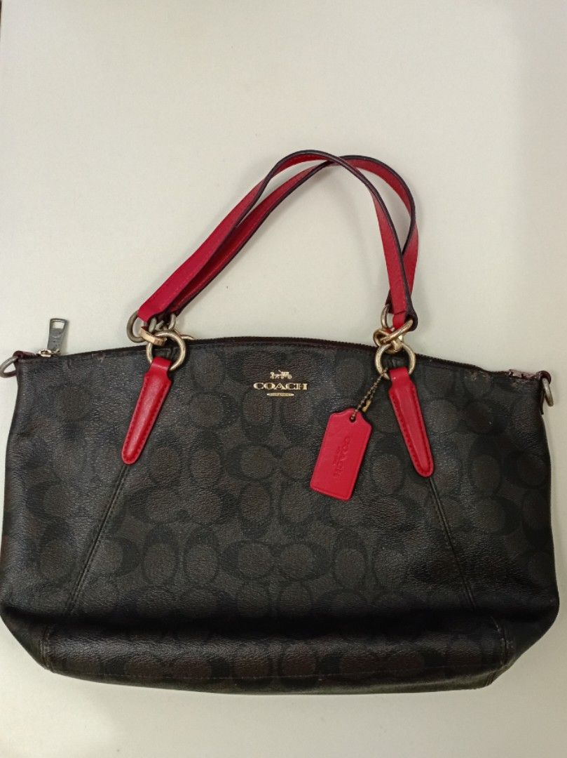 COACH ❤️ Canvas leather Shoulder /Handbag (Category: Luxury Bags & Wallets) located in Navotas City. Submitted by riyuwi (Listing ID 1461992334, Image 1). Description: PreOwned WellUsed Authentic 💯 Classic Coach brown monogram Shoulder / handbag -Medium - Color: Brown with signature 'C' pattern - Trim and handles: Red leather - Includes: Red Coach hang tag - Closure: Zipper Sign of Used Faded hardwares , Good Condition 8.8/10 .