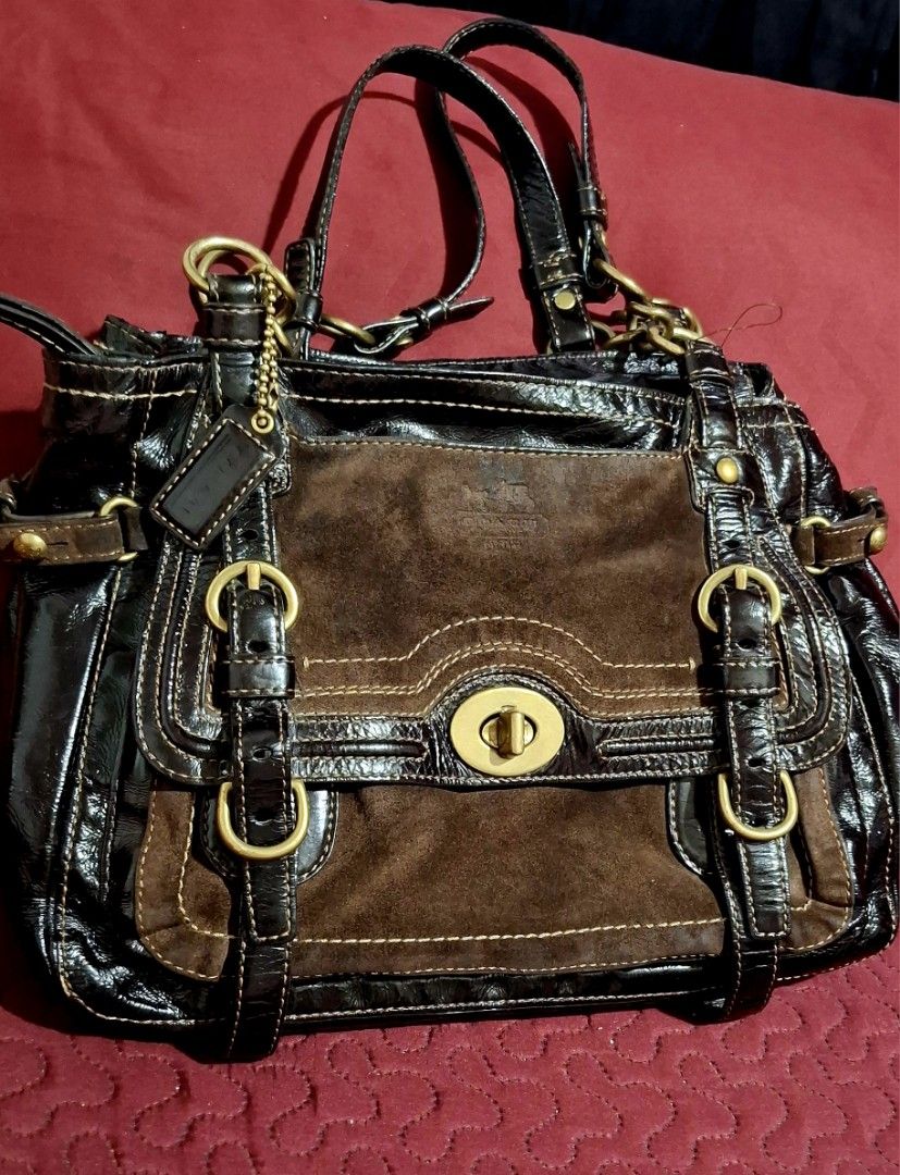 Coach bag (Category: Shoulder Bags) located in Batangas. Submitted by maryann22 (Listing ID 1461806526, Image 1). Description: - Authentic Coach bag - Color: Brown - Materials: Patent leather and suede - Features: Turn-lock closure, buckle details - Style: Chic and versatile - Condition: Pre-loved.