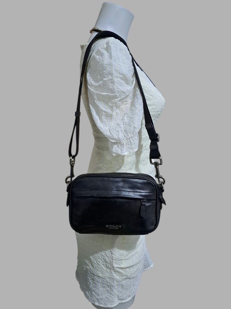 Coach Black Leather Sling Bag (Category: Luxury Bags & Wallets) located in Quezon City. Submitted by kirstenbella (Listing ID 1461932690, Image 3). Description: - 💯Authentic Coach Graham Crossbody F39946 - Camera Bag - Made of pure Genuine Leather - Adjustable wide strap - Convenient front zip pocket - Spacious main compartment - Stylish silver hardware details - Clean and simple design - H 6" x L 9" x D 2.5" Inches - NO Issue In Excellent condi