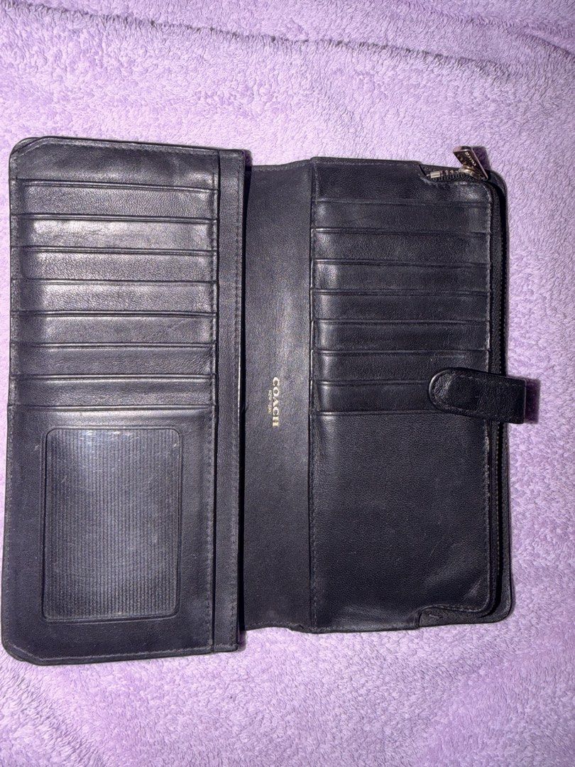 Coach Black Leather Wallet (Category: Wallets & Card holders) located in Manila. Submitted by floratheexplorer09 (Listing ID 1461822122, Image 3). Description: - Genuine black leather Coach wallet - Secure snap closure - Convenient zip-around compartment - Ample card slots for all your cards - Clear ID window for easy access - Perfect for keeping your essentials organized.