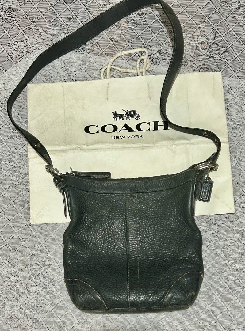 Coach Black pebble Leather Hobo Shoulder Bag (Category: Luxury Bags & Wallets) located in Plaridel. Submitted by ilovebubu28 (Listing ID 1461861627, Image 1). Description: - Authentic black Coach hobo bag - Made from pebbled leather - Zippered top closure - Front zip pocket - Interior with light blue lining - Adjustable strap With coach bagtag.