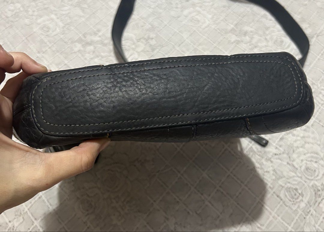 Coach Black pebble Leather Hobo Shoulder Bag (Category: Luxury Bags & Wallets) located in Plaridel. Submitted by ilovebubu28 (Listing ID 1461861627, Image 3). Description: - Authentic black Coach hobo bag - Made from pebbled leather - Zippered top closure - Front zip pocket - Interior with light blue lining - Adjustable strap With coach bagtag.
