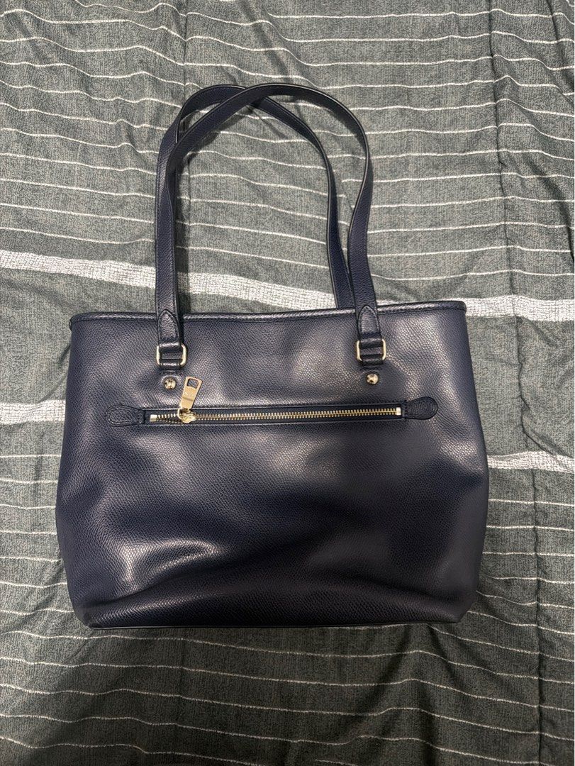 Coach Pebbled Leather Tote Bag - Navy Blue (Category: Luxury Bags & Wallets) located in Manila. Submitted by taftkid_07 (Listing ID 1461949458, Image 3). Description: - Brand: Coach - Color: Navy Blue - Material: Pebbled Leather - Style: Tote Bag - Closure: Zip - Handles: Top Handles - Hardware: Gold-tone - Interior: Zippered pocket and slip pockets - Features: Spacious, great for everyday use MOP: Maya/Gcash .