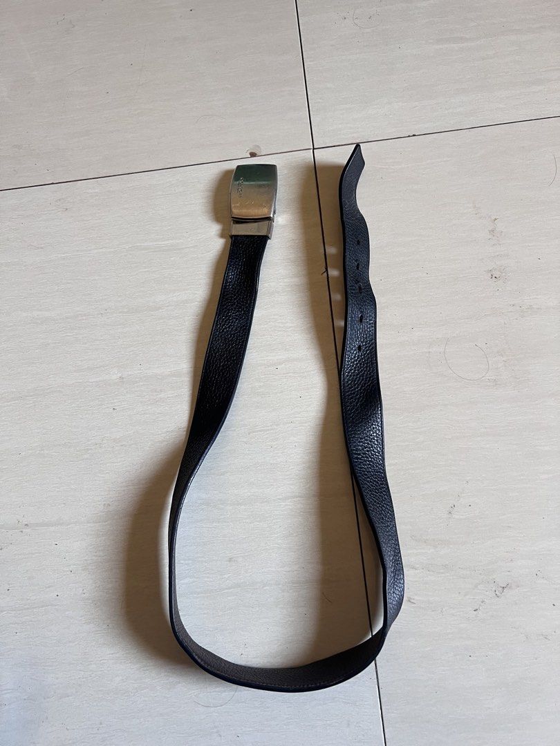 Coach Reversible Belt (Category: Belts) located in Zamboanga. Submitted by safe.haimer (Listing ID 1461920010, Image 1). Description: - Coach Leather Belt - Reversible: Black on one side, Dark Brown on the other - Silver Buckle (minor scratches) - Length: Approximately 32 inches - Perfect accessory for any outfit.