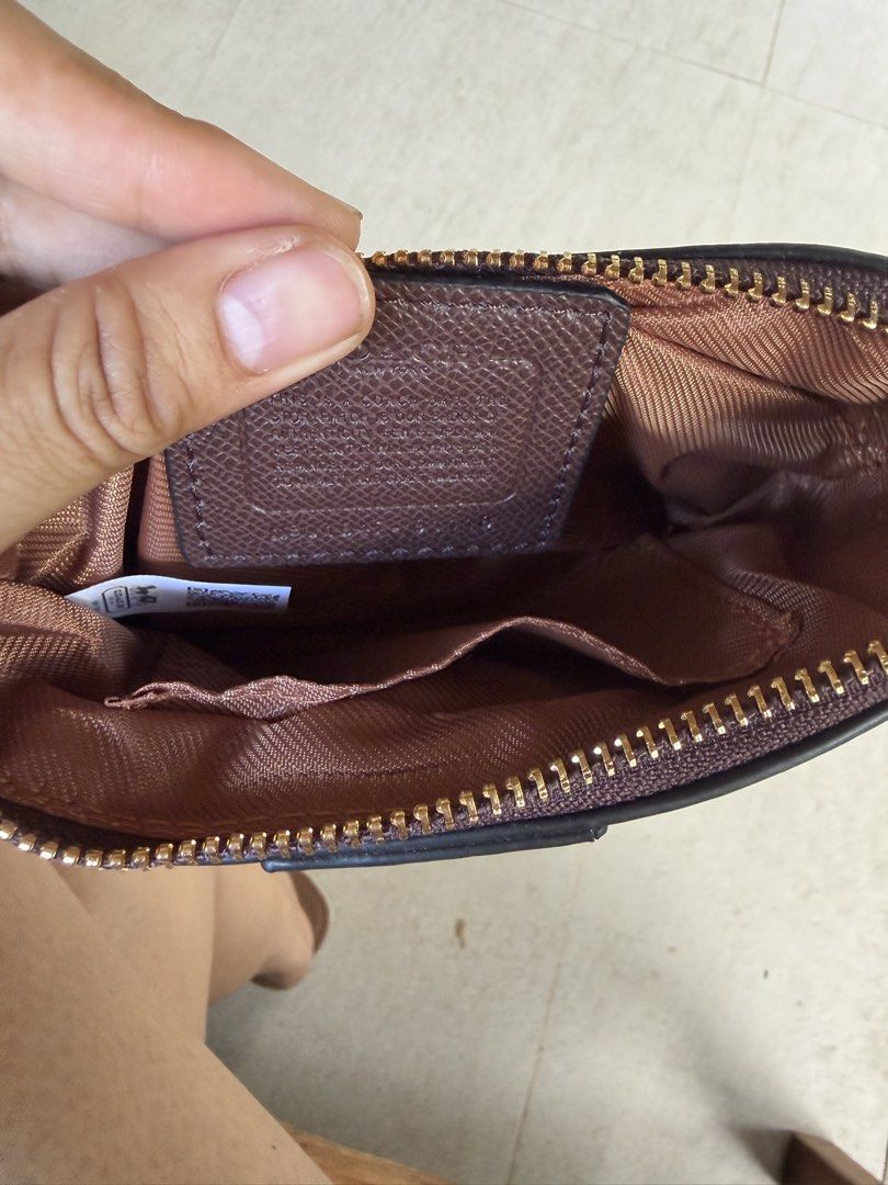 Coach Signature Canvas Wristlet Pouch (Category: Other Bottoms) located in Dumalag. Submitted by pili.ph (Listing ID 1461823958, Image 2). Description: - Two Coach wristlets available - Signature 'C' monogram canvas - Brown leather stripe detail - Gold-tone hardware - Zipper closure - Interior card slots - Ideal for carrying essentials Not Authentic! .