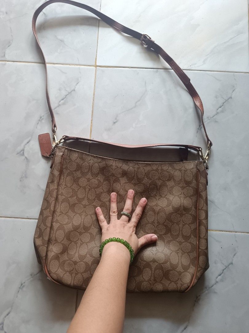 Coach Signature Monogram Shoulder Bag (Category: Shoulder Bags) located in Naga. Submitted by elzza_zenitram (Listing ID 1461861551, Image 2). Description: For sale preloved Premium quality Coach Celeste Convertible Hobo bag -Signature Canvas. With minimal signs of usage. Rfs: no longer in use bawas gamit. For pick-up and delivery only. .