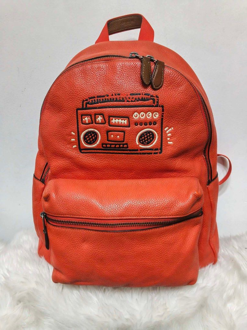 Coach x Keith Haring Boombox backpack (Category: Backpacks) located in Malolos. Submitted by urban_thrift_09 (Listing ID 1461924558, Image 1). Description: Orange pebbled leather Coach x Keith Haring Boombox backpack Size reference & details in photos.