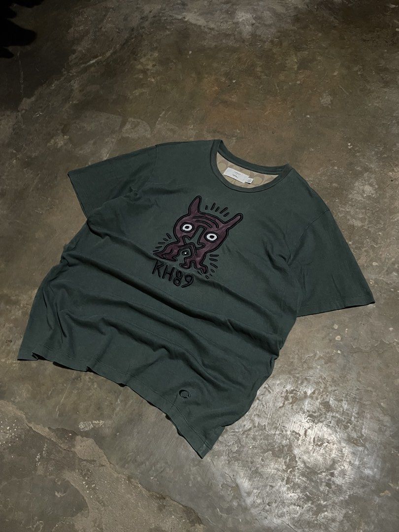 Coach x Keith Haring Graphic Tee Dark Green (Category: Tshirts & Polo Shirts ) located in Santa Cruz. Submitted by _darskieeezz (Listing ID 1461969303, Image 2). Description: Actual Dimes 21 by 27 medium Embroidered Design Looks great!.