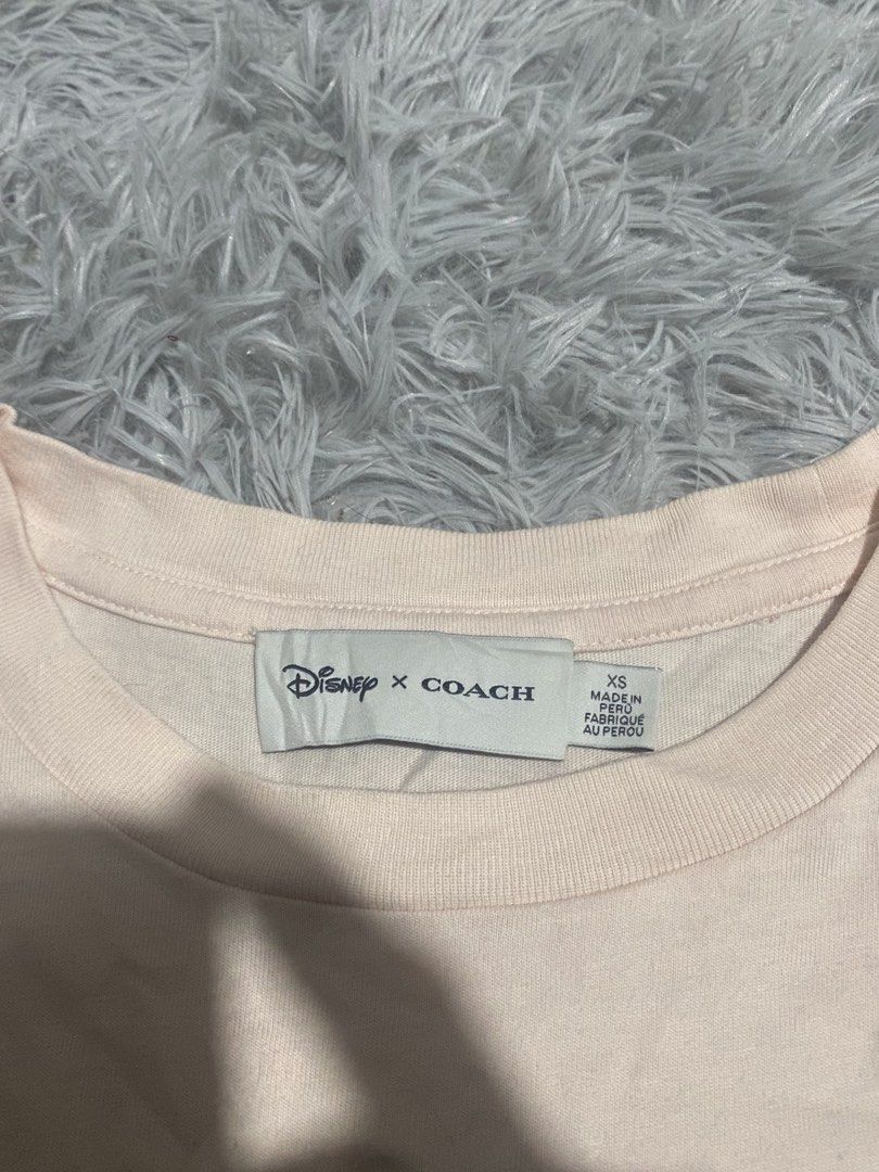 Coachc x Disney (Category: Activewear) located in Lapu Lapu. Submitted by ericbuotjr (Listing ID 1461856355, Image 2). Description: COMPLETE TAGS‼️ Legit -Size: extra small -Dimes: 20x26 -Color rate: 9.5/10 - Excellent condition - Issue: baby hairline backhit.