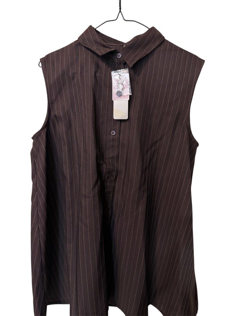 COCA Brown Pinstripe Sleeveless top (Category: Sleeveless) located in Quezon City. Submitted by kcobs (Listing ID 1461816678, Image 1). Description: - Brown sleeveless shirt - Pinstripe pattern - Collared neckline - Button-up front - Pleated detail on the back - excellent condition, never worn, recent purchase from my Osaka trip - Original tag still attached - Purchased from LET'S GO ONLINE STORE - Versatile for layering or wearing solo.