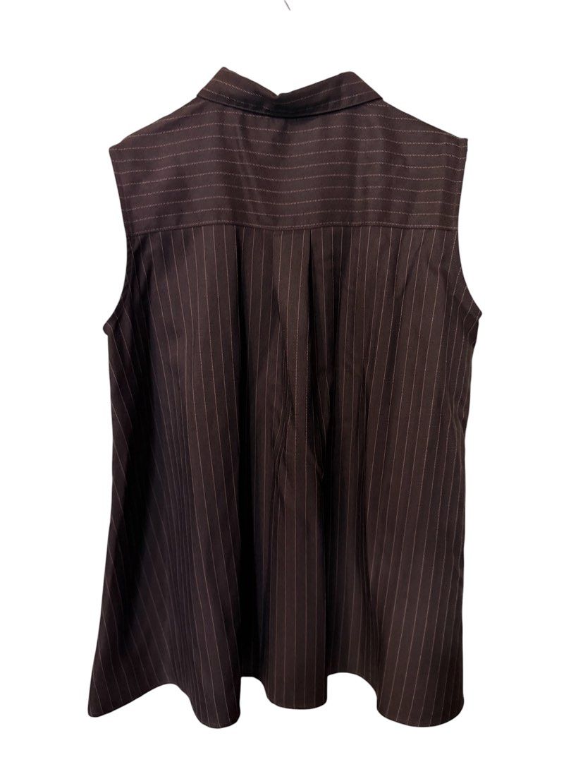 COCA Brown Pinstripe Sleeveless top (Category: Sleeveless) located in Quezon City. Submitted by kcobs (Listing ID 1461816678, Image 2). Description: - Brown sleeveless shirt - Pinstripe pattern - Collared neckline - Button-up front - Pleated detail on the back - excellent condition, never worn, recent purchase from my Osaka trip - Original tag still attached - Purchased from LET'S GO ONLINE STORE - Versatile for layering or wearing solo.
