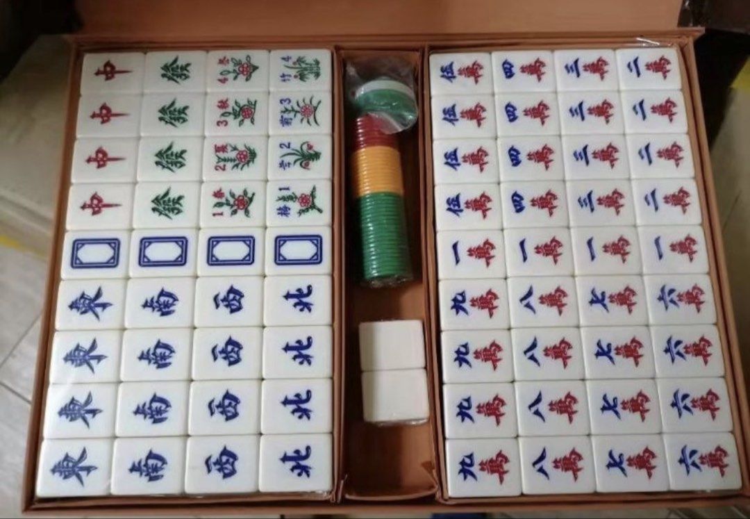 Complete Mahjong Set with Tiles and Accessories (Category: Board Games & Puzzles) located in Manila. Submitted by merylaloja98489 (Listing ID 1461931094, Image 1). Description: - Brand new standard size full Mahjong set for complete gameplay. - Includes all necessary tiles and dice. - Tiles are clear and easy to read. - Comes in a durable leather box for convenient transportation and storage. - Ideal for family gatherings and playing with friends