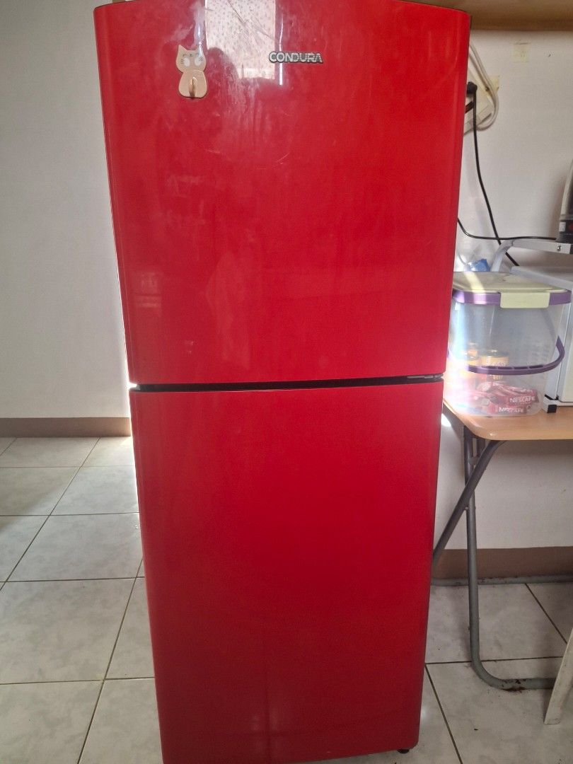 Condura Red Double Door Refrigerator (Category: Refrigerators and Freezers) located in Manila. Submitted by pattycakes47 (Listing ID 1462016347, Image 2). Description: - Red Condura Double Door Refrigerator - Top compartment for fresh food, bottom for freezer - Still works well - Minor ice buildup in the freezer - Ideal for small households or dorm rooms - Approximate Dimensions: 2ft (W) x 4.5ft (H) x 2ft (D) - Pick up only - RFS my mom's moving 