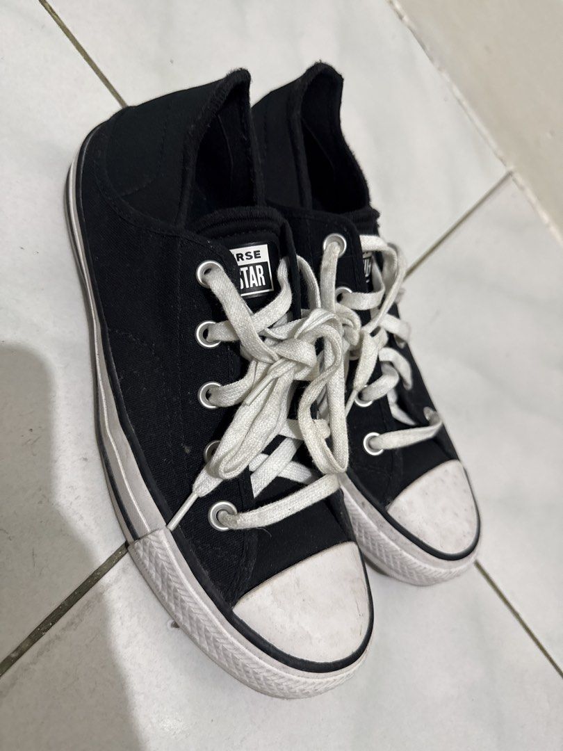 Converse All Star Black Low Top Sneakers (Category: Sneakers) located in Manila. Submitted by thriftwitlove (Listing ID 1461949490, Image 2). Description: - Classic black Converse All Star low tops - Size: 8 US Women's - Material: Canvas upper with rubber toe cap - Features: White laces and sole - Condition: lightly Used, with typical scuffs on toe cap and sole - Ideal for: Everyday sneakers ------All washable/removable stain/dirt.