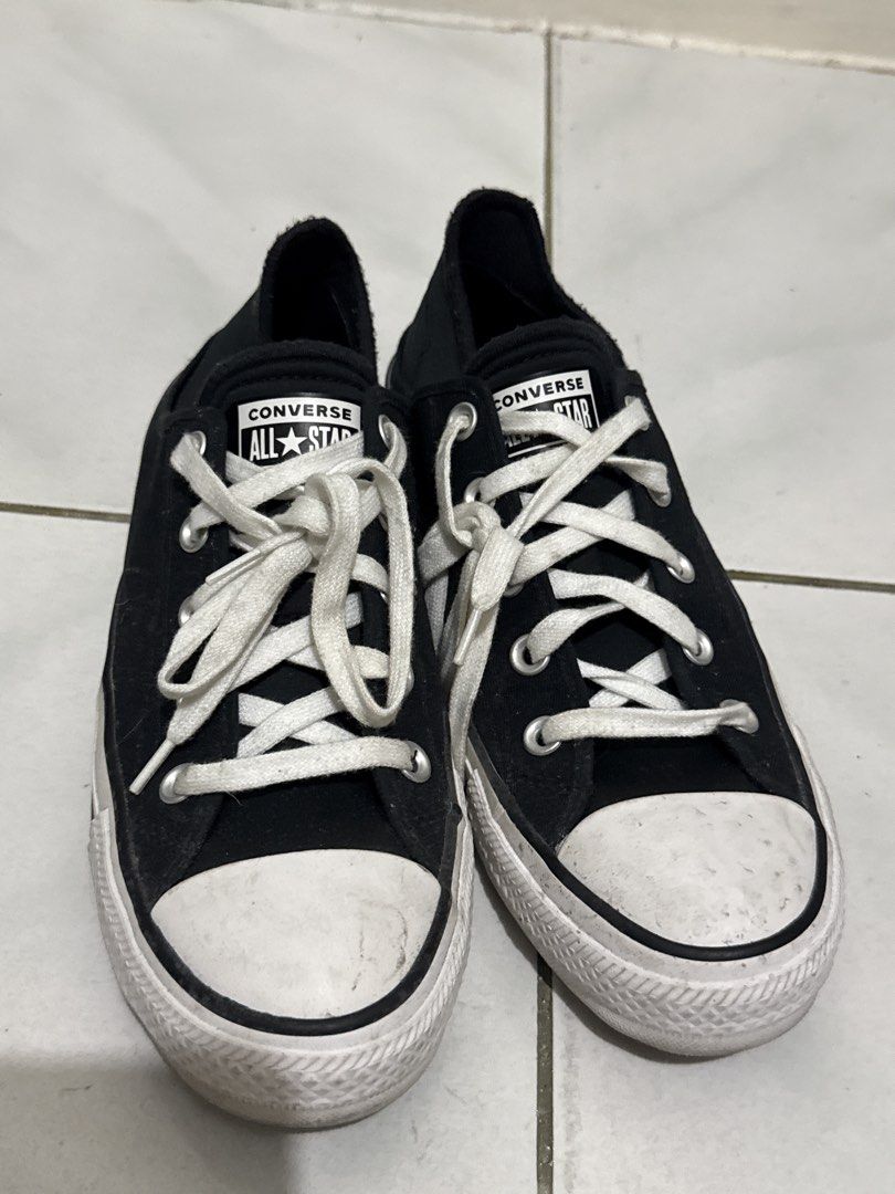 Converse All Star Black Low Top Sneakers (Category: Sneakers) located in Manila. Submitted by thriftwitlove (Listing ID 1461949490, Image 1). Description: - Classic black Converse All Star low tops - Size: 8 US Women's - Material: Canvas upper with rubber toe cap - Features: White laces and sole - Condition: lightly Used, with typical scuffs on toe cap and sole - Ideal for: Everyday sneakers ------All washable/removable stain/dirt.