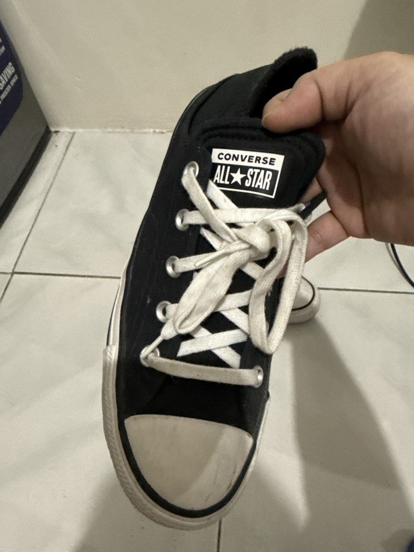 Converse All Star Black Low Top Sneakers (Category: Sneakers) located in Manila. Submitted by thriftwitlove (Listing ID 1461949490, Image 3). Description: - Classic black Converse All Star low tops - Size: 8 US Women's - Material: Canvas upper with rubber toe cap - Features: White laces and sole - Condition: lightly Used, with typical scuffs on toe cap and sole - Ideal for: Everyday sneakers ------All washable/removable stain/dirt.