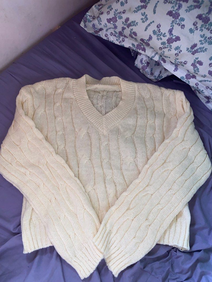 Cream Cable Knit V-Neck Sweater (Category: Coats, Jackets and Outerwear) located in San Jose del Monte. Submitted by skyarraa (Listing ID 1461880319, Image 1). Description: - Cream colored sweater - Classic cable knit pattern - V-neckline - Long sleeves - Cozy and warm feel - Versatile for layering or standalone wear - Easy to style with jeans or skirts.