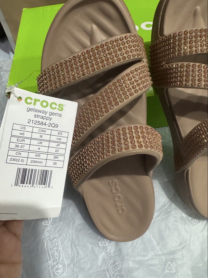 Crocs Getaway Gems Strappy Sandals (Category: Flats & Sandals) located in Quezon City. Submitted by andreaeliz (Listing ID 1461855965, Image 2). Description: - Brand: Crocs - Model: Getaway Gems Strappy Sandals - Color: Neutral Beige - Features: Embellished with sparkly gems on straps - Style: Comfortable and stylish for everyday wear - Condition: New with original box and tags.