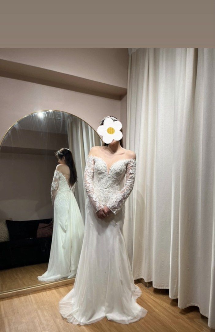 CUSTOM WEDDING GOWN FOR SALE (Category: Evening dresses & gowns) located in Quezon City. Submitted by jdeauna (Listing ID 1461838496, Image 2). Description: 🤍 CUSTOM WEDDING GOWN FOR SALE Letting go of my custom-made wedding gown, worn once last February 2025. 🤍 Details: • Off-shoulder neckline • Long sheer lace sleeves • Intricate lace • Fit-and-flare / mermaid-inspired silhouette • Low back with button detailing • Extended train • Ivory/champ