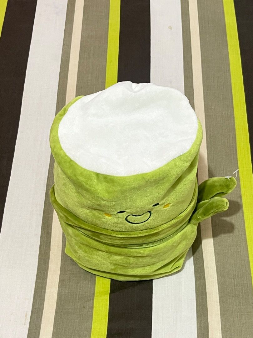 Cute Plushie Pouch (Category: Plushies & Soft Toys) located in Santa Rosa. Submitted by rsxyen (Listing ID 1461992541, Image 3). Description: - Adorable green plush character with a cheerful expression. - Zippered opening reveals a spacious interior. - Interior lined with a cute checkered pattern. - Versatile use: great for storing small items or as a fun decor piece. - Perfect gift for children or enthusiasts of cute plush toys..
