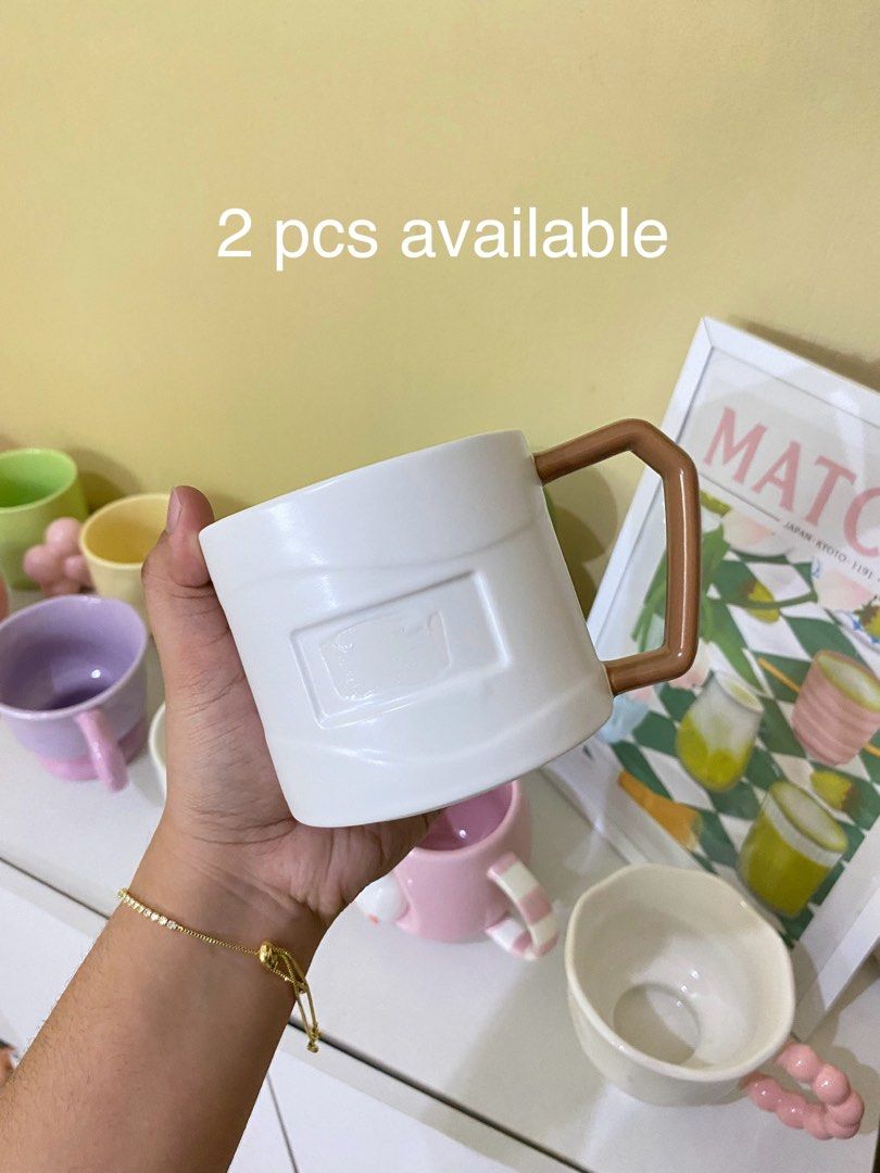 CUTE WHITE WITH BROWN HANDLE MUG (Category: Coffee & Tea Tableware) located in Dasmarinas. Submitted by hannah.oakph (Listing ID 1461861442, Image 1). Description: ₱150 EACH • 2 FOR ₱250.