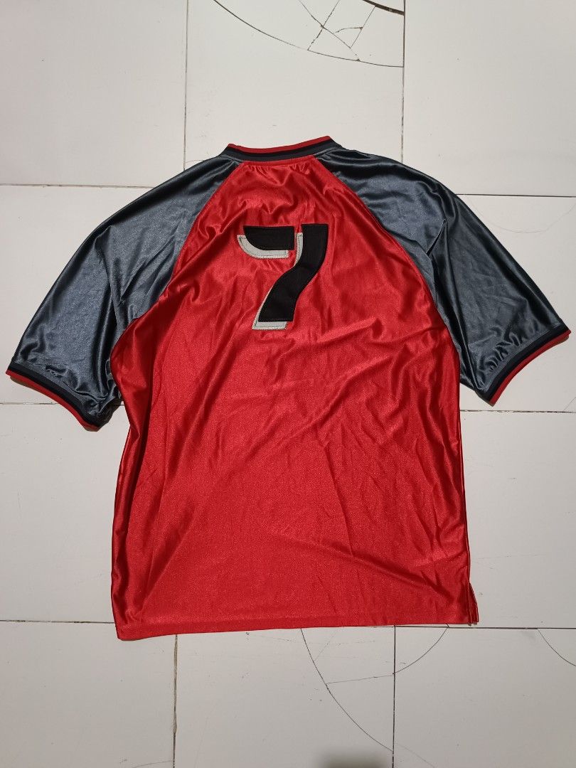 Dada Supreme Red Jersey with Number 7 (Category: Tshirts & Polo Shirts ) located in Barotac Nuevo. Submitted by gray101 (Listing ID 1461973347, Image 2). Description: - Dada Supreme Jersey - Color: Red and Grey - Features Dada Supreme logo on front - Number '7' on the back - Material: 100% Polyester - Size: XXXL - Ideal for sports or casual wear.