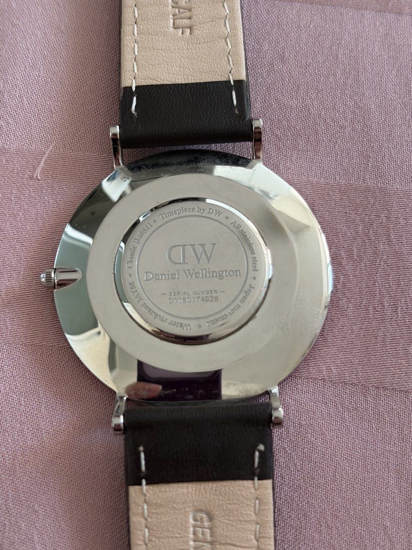 Daniel Wellington Classic Watch (Category: Men's Watches) located in Quezon City. Submitted by smorata (Listing ID 1462029040, Image 2). Description: ✨ Brand: Daniel Wellington (DW) 🖤 dark brown leather strap 🩶 Silver-tone stainless steel case 🖤 Classic black minimalist dial with slim markers ✨ Elegant and timeless design — perfect for everyday or formal wear 📸 Actual photos posted — front and back shown.
