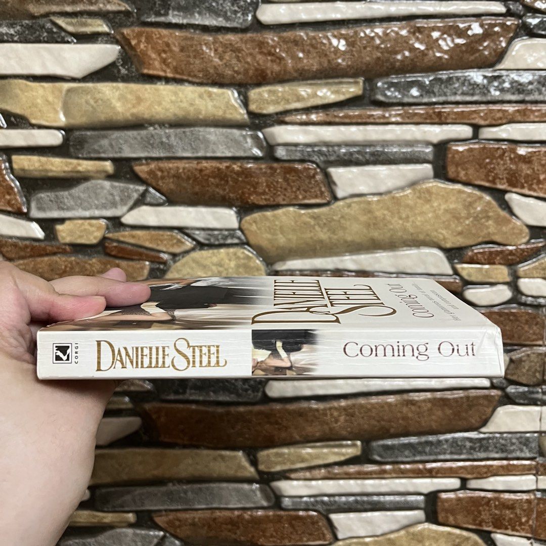 Danielle Steel Coming Out Paperback Novel (Category: Storybooks) located in San Pedro. Submitted by rainyydayy (Listing ID 1461964121, Image 3). Description: - Title: Coming Out by Danielle Steel - Genre: Romance / Family Drama - Themes: Family, love, compassion, emotional journeys - Plot: Follows Olympia's life, career, marriage, and her daughters' coming of age. - Style: Glamorous novel - Perfect for: Your next captivating read!.