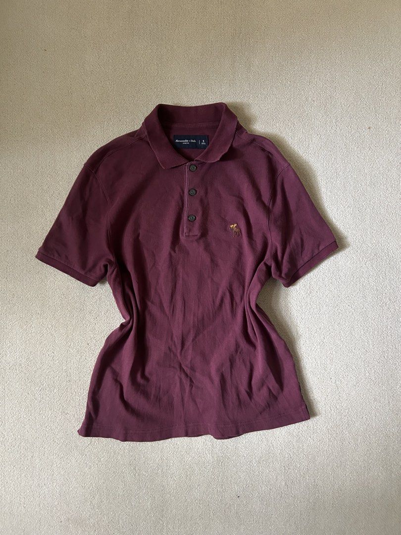 Dark Red Polo Abercrombie shirt (Category: Shirts) located in Quezon City. Submitted by y2klar (Listing ID 1461992413, Image 1). Description: Dark red abercrombie shirt Size-M-L Length-27 Width-21 10/10 Condition no flaws.