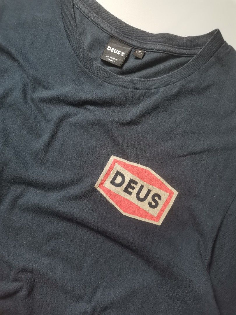 Deus Ex Machina Speed Stix Tee (Category: Tshirts & Polo Shirts ) located in Tacloban City. Submitted by azthrifting24 (Listing ID 1461987957, Image 2). Description: - Brand: Deus Ex Machina - Color: Black - Material: 100% Cotton - Front Design: Small Deus logo - Back Design: 'Deus Ex Machina Custom Cycles Tokyo Japan' graphic - SIZE: X-LARGE WIDTH: 21. 5 LENGTH: 31 EXCELLENT CONDITON COLOR RATE: 9.5/10 PRICE: 550 + SHIPPING FEE .
