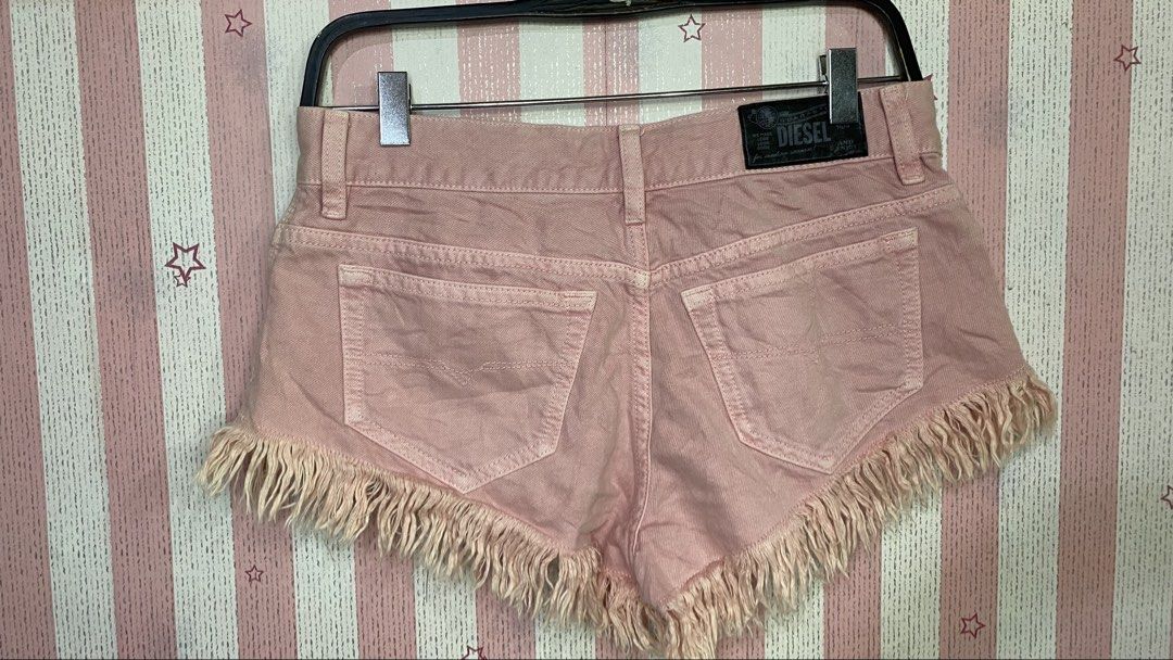 Diesel micro vintage y2k super short mini short (Category: Shorts) located in President Roxas. Submitted by starksandmoon_ii (Listing ID 1461913655, Image 2). Description: - Pink Diesel denim shorts - Frayed fringe hem - Classic five-pocket styling - Button and zip closure - Made from 100% cotton - Ideal for casual wear 26 on tag.
