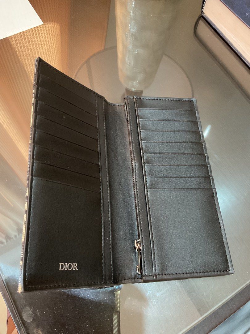 Dior Monogram Canvas Long Wallet (Category: Luxury Bags & Wallets) located in Cagayan de Oro. Submitted by ericlarkyl89146 (Listing ID 1461849808, Image 2). Description: - Dior long wallet - Classic Dior monogram canvas exterior - Black leather interior - Multiple card slots for organization - Zippered coin pocket - Dior branded zipper pull - Ideal for keeping essentials tidy.