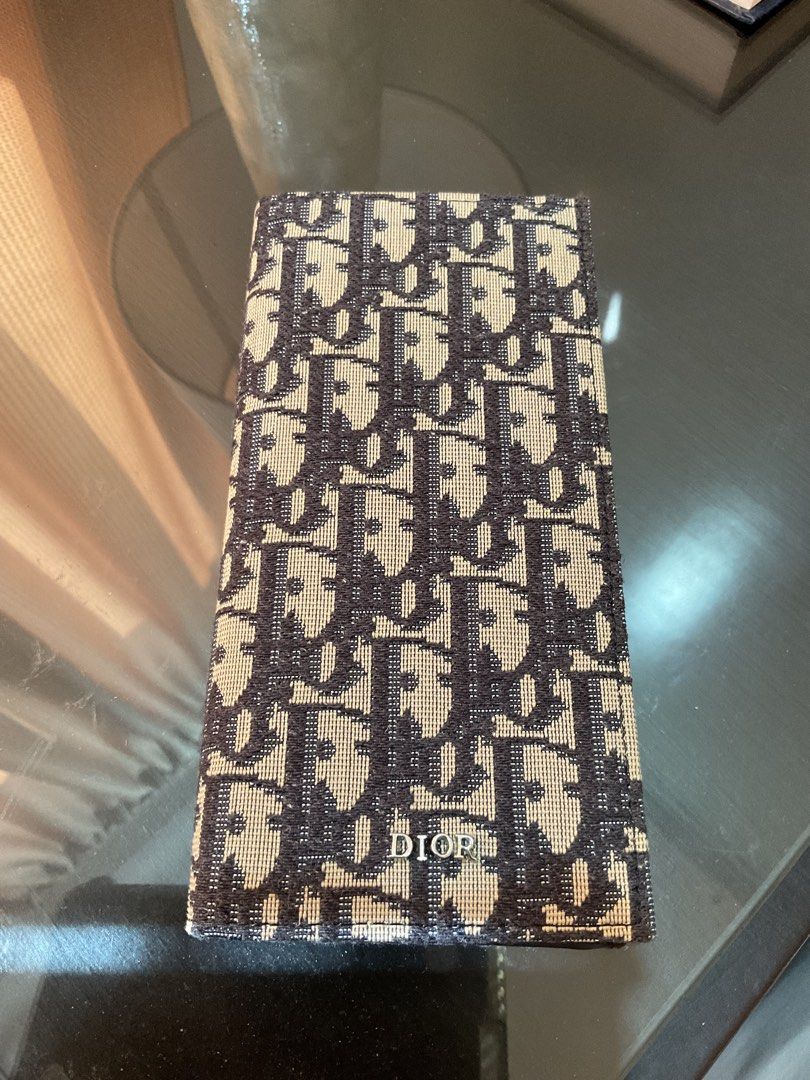 Dior Monogram Canvas Long Wallet (Category: Luxury Bags & Wallets) located in Cagayan de Oro. Submitted by ericlarkyl89146 (Listing ID 1461849808, Image 1). Description: - Dior long wallet - Classic Dior monogram canvas exterior - Black leather interior - Multiple card slots for organization - Zippered coin pocket - Dior branded zipper pull - Ideal for keeping essentials tidy.