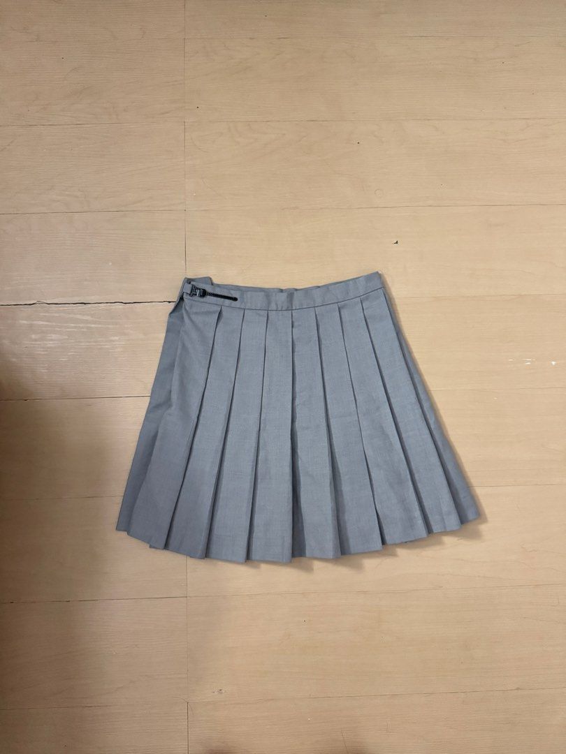 Dior top / Pleated skirt bundle (Category: Luxury Apparel) located in Manila. Submitted by juhjuh (Listing ID 1461853356, Image 2). Description: - White Christian Dior polo shirt - Top: s/m Skirt: 26 - Navy trim on polo shirt - Small embroidered logo on chest - Grey pleated skirt included - Creates a preppy look - Suitable for casual outings or a sporty vibe.