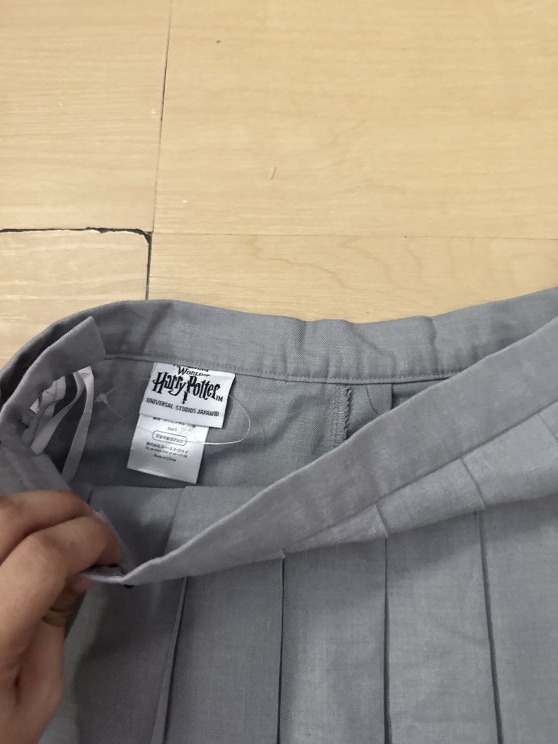 Dior top / Pleated skirt bundle (Category: Luxury Apparel) located in Manila. Submitted by juhjuh (Listing ID 1461853356, Image 3). Description: - White Christian Dior polo shirt - Top: s/m Skirt: 26 - Navy trim on polo shirt - Small embroidered logo on chest - Grey pleated skirt included - Creates a preppy look - Suitable for casual outings or a sporty vibe.
