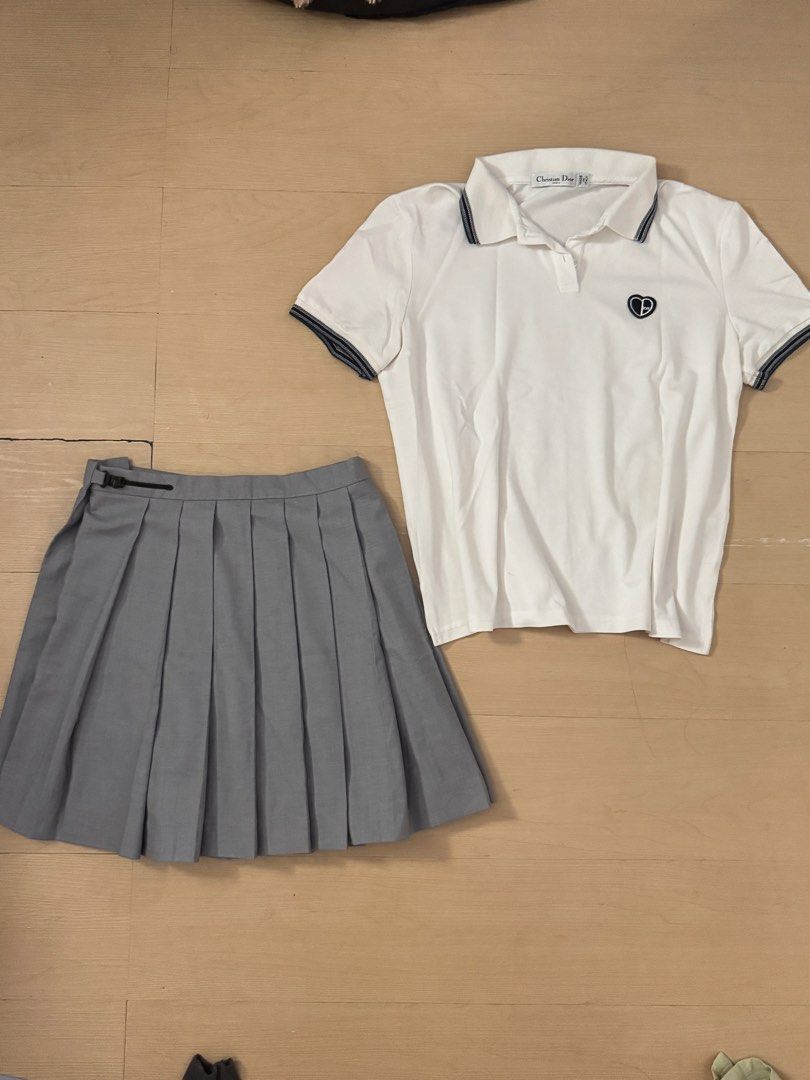 Dior top / Pleated skirt bundle (Category: Luxury Apparel) located in Manila. Submitted by juhjuh (Listing ID 1461853356, Image 1). Description: - White Christian Dior polo shirt - Top: s/m Skirt: 26 - Navy trim on polo shirt - Small embroidered logo on chest - Grey pleated skirt included - Creates a preppy look - Suitable for casual outings or a sporty vibe.