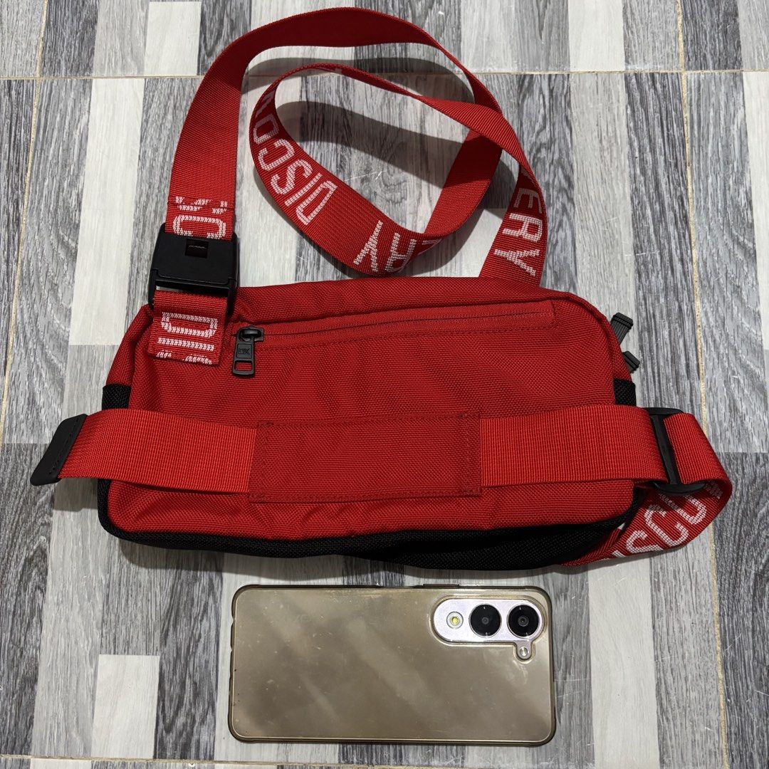 Discovery Expedition Red Chest Bag (Category: Belt bags, Clutches and Pouches) located in Banga. Submitted by akosiloco (Listing ID 1461919865, Image 2). Description: - Red chest bag from Discovery Expedition - Multiple zippered compartments and pockets for organization - Adjustable strap with buckle closure for a secure fit - Ideal for hands-free carrying of essentials - Durable material, suitable for travel or daily use.