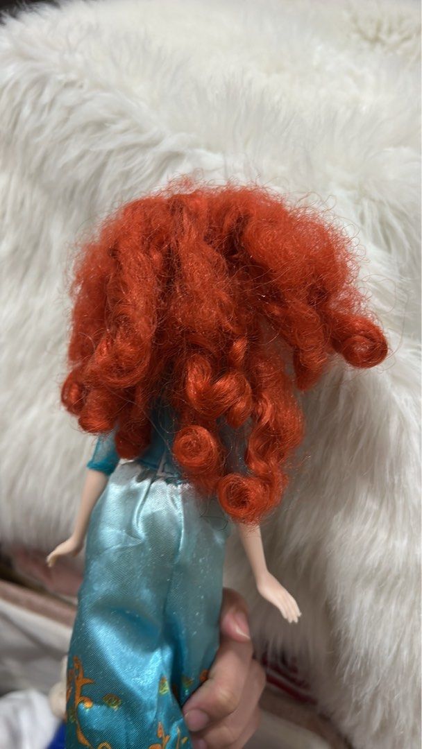 Disney Brave Merida Doll (Category: Figurines & Statues) located in Batangas. Submitted by nommi26 (Listing ID 1461965910, Image 3). Description: WYSIWYG - Merida doll from Disney's Brave - Signature curly red hair and blue eyes - Wears iconic blue dress with gold accents - Hair is a bit messy but still looks great - Ideal for any Disney fan.
