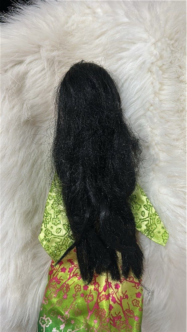 Disney Mulan Doll (Category: Figurines & Statues) located in Batangas. Submitted by nommi26 (Listing ID 1461966730, Image 2). Description: WYSIWYG - Mulan doll in her traditional outfit - Features a green patterned robe with a blue sash - Yellow skirt adorned with pink floral accents - Long, flowing black hair - Ideal for collectors or for playtime.