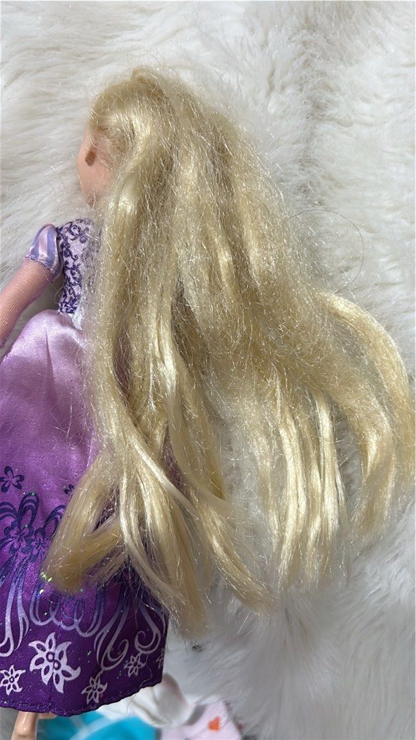 Disney Princess Rapunzel Doll (Category: Kids Toys) located in Batangas. Submitted by nommi26 (Listing ID 1461966250, Image 2). Description: WYSIWYG - Disney's Rapunzel doll from Tangled - Features long blonde hair - Wears her iconic purple dress with glitter details - Hair is a little tangled - Ideal for any Disney enthusiast.