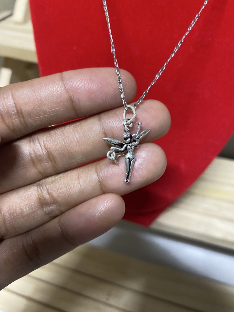 Disney Tinkerbell Sterling Silver 925 Necklace (Category: Necklaces) located in Pasacao. Submitted by wengpullar37205 (Listing ID 1461986910, Image 2). Description: - Genuine sterling silver (marked 925) - Adorable Tinkerbell pendant with a tiny star charm - Delicate and sparkly chain - Secure spring ring clasp - Ideal gift for Disney fans.