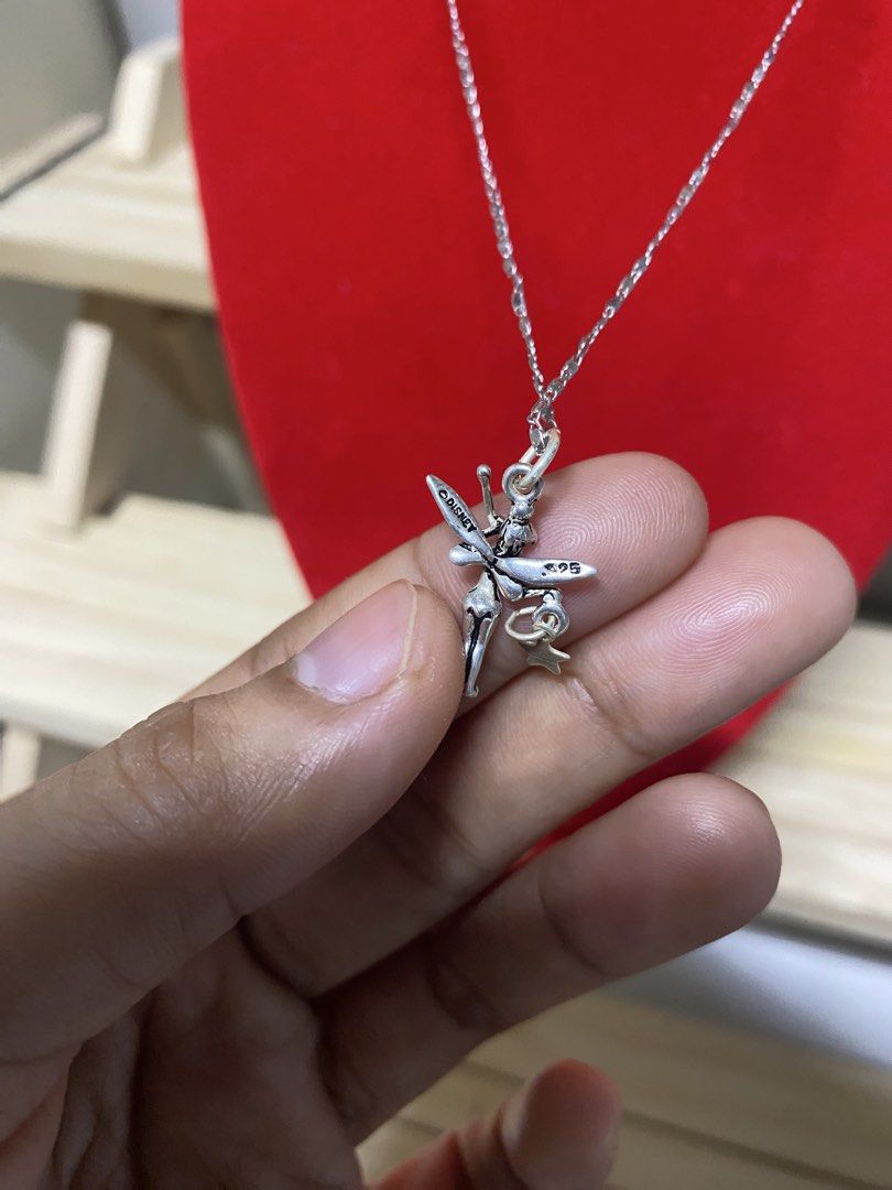 Disney Tinkerbell Sterling Silver 925 Necklace (Category: Necklaces) located in Pasacao. Submitted by wengpullar37205 (Listing ID 1461986910, Image 3). Description: - Genuine sterling silver (marked 925) - Adorable Tinkerbell pendant with a tiny star charm - Delicate and sparkly chain - Secure spring ring clasp - Ideal gift for Disney fans.