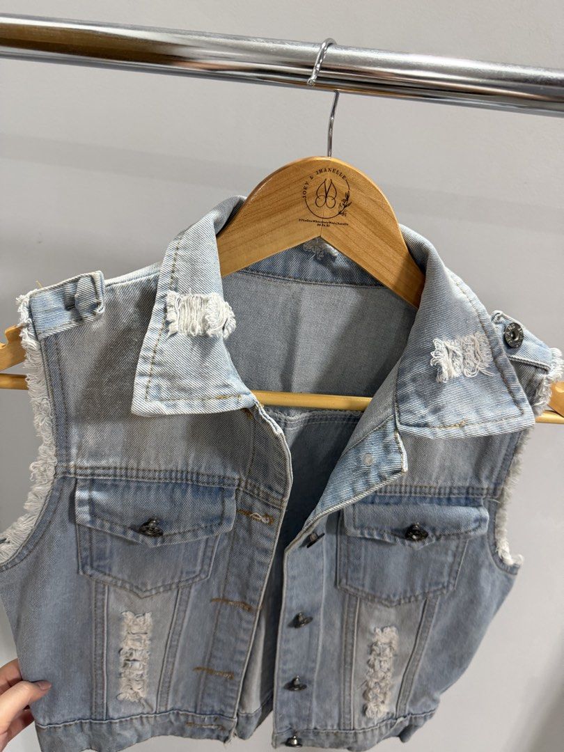 Distressed Denim Vest (Category: Others Tops) located in Taguig. Submitted by dyaaanel (Listing ID 1461925571, Image 3). Description: 🤍 Distressed Denim Vest 👗 Size: XS–S 💙 Color: Denim 🏷️ Condition: Pre-loved. With issue: loose button on the shoulder (see photo). 💸 Selling for ₱150 📸 Actual photos for reference. RFS: Decluttering unused and slightly used clothes. Disclaimer: some items are pre-loved unless stated otherwise. Please manage y