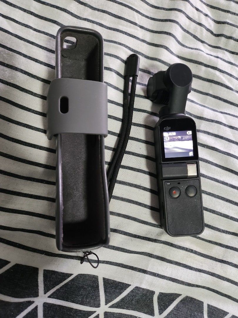 DJI Osmo Pocket 1 (Category: Cameras) located in Pasig City. Submitted by zharre.062923 (Listing ID 1461799552, Image 1). Description: - DJI Osmo Pocket gimbal camera - Capture smooth video effortlessly - Compact and portable for travel - Includes original protective case - Excellent working condition - Ideal for your next adventure!.