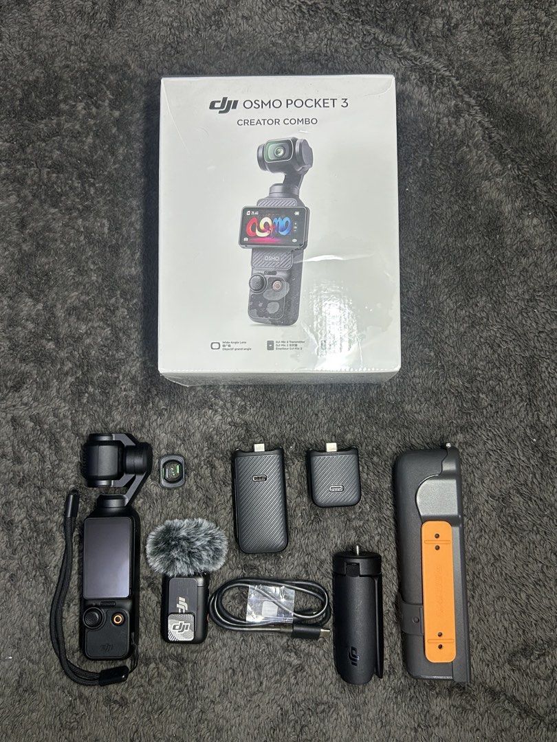 DJI Osmo Pocket 3 Creator Combo Gimbal Camera (Category: Cameras) located in Rizal. Submitted by mrklawrnc (Listing ID 1461974755, Image 1). Description: - DJI Osmo Pocket 3 Creator Combo - Includes gimbal camera, wireless microphone, and battery handle - Ideal for vlogging and content creation ❗️For sale❗️ DJI Osmo Pocket 3 Creator Combo Inclusions: - Osmo pocket 3 - Type C cable - Protective cover with lid and strap - Carrying bag - Handle with