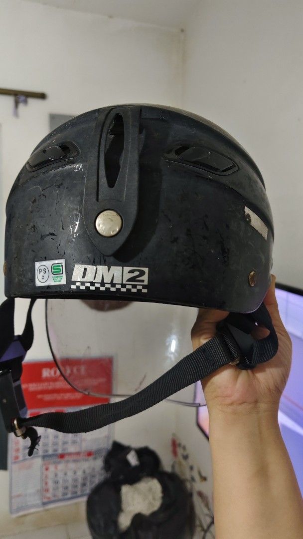 DM2 Motorcycle Helmet with Visor (Category: Helmets and other Riding Gears) located in Bulacan. Submitted by babz30261 (Listing ID 1461917953, Image 2). Description: - DM2 Motorcycle Helmet - Includes clear visor - Features quick-release buckle strap - Exterior has scuffs and scratches - Fully functional and safe to use - Sold as is.