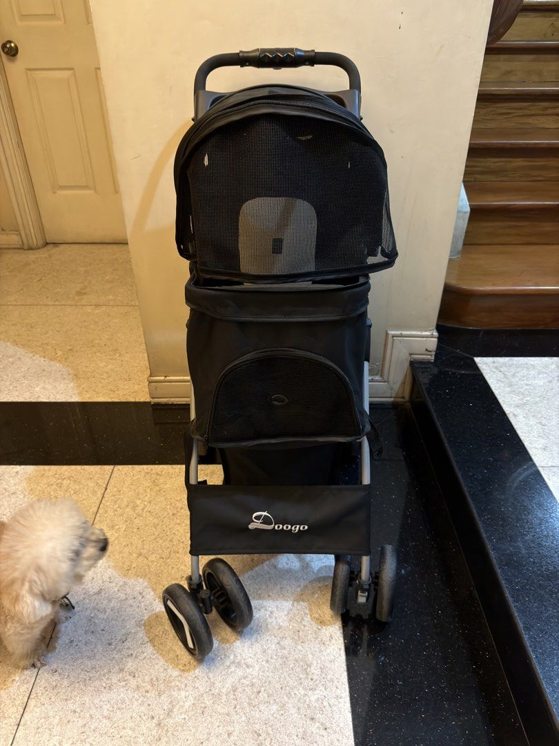 Doogo Pet Stroller - Black (Category: Homes & Other Pet Accessories) located in Quezon City. Submitted by tanyasy_52 (Listing ID 1461904562, Image 1). Description: - Black Doogo pet stroller - Mesh top for ventilation and visibility - Bottom storage basket included - Handlebar with cup holders - Easy to fold and transport - Perfect for taking your pet out price negotiable.